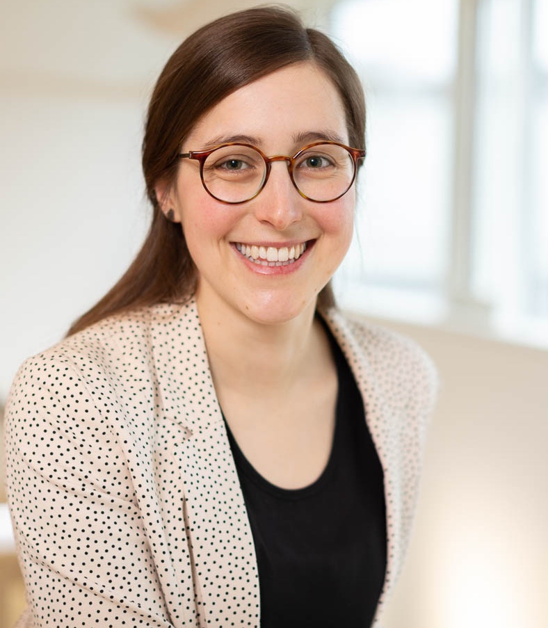 Portrait photo of Dr. Teresa Wagner, a woman with long brown hair and glasses.